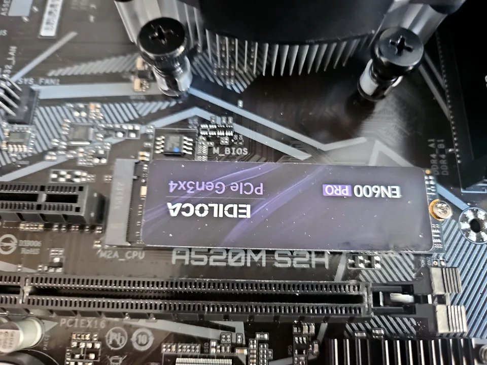 SSD fitted to a desktop motherboard during an upgrade