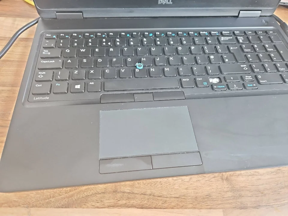 Laptop Touchpad Not Working in Birmingham? Driver, Battery Swelling or Hardware Fault? Dell laptop touchpad and keyboard photographed at the PC Repair Guru workshop
